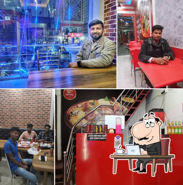 Take a seat at one of the tables at Pizza Slice