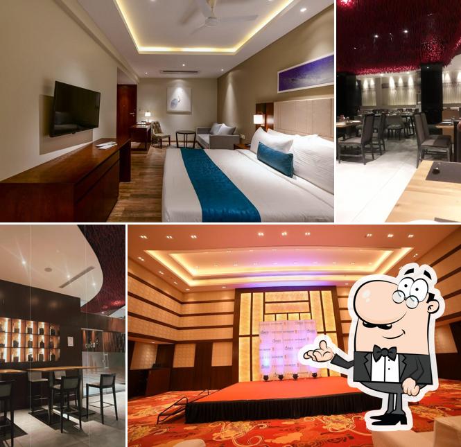 Take a seat at one of the tables at COCOON HOTEL SANGLI