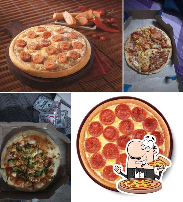 Try out pizza at Domino's Pizza