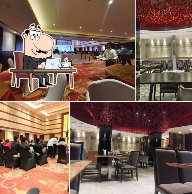 Take a seat at one of the tables at COCOON HOTEL SANGLI