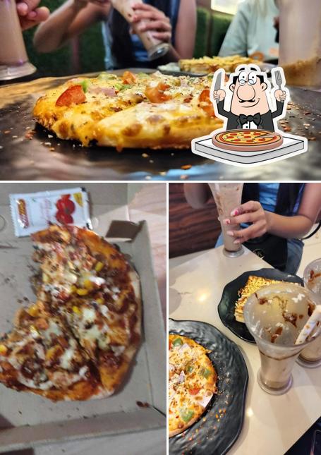 Try out pizza at CHAI BISKUT CAFE