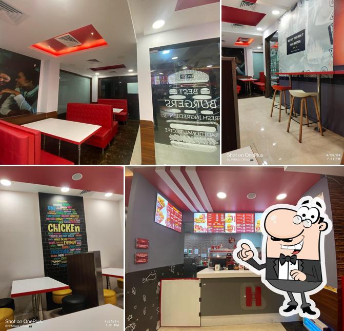 Take a seat at one of the tables at Heatsquare Restaurant Palladam