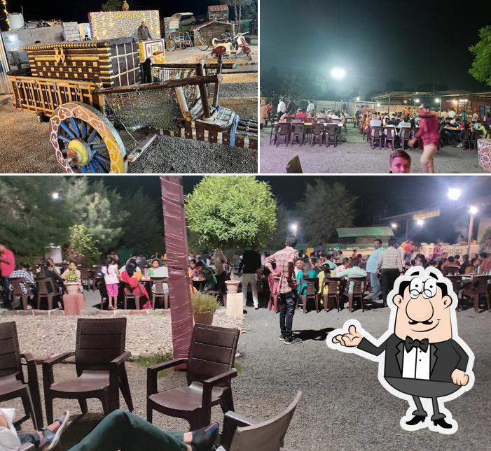 Take a seat at one of the tables at Navdurga Restaurant