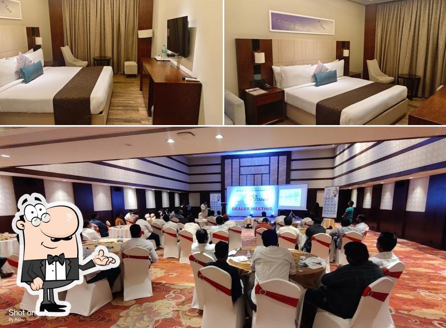 Take a seat at one of the tables at COCOON HOTEL SANGLI