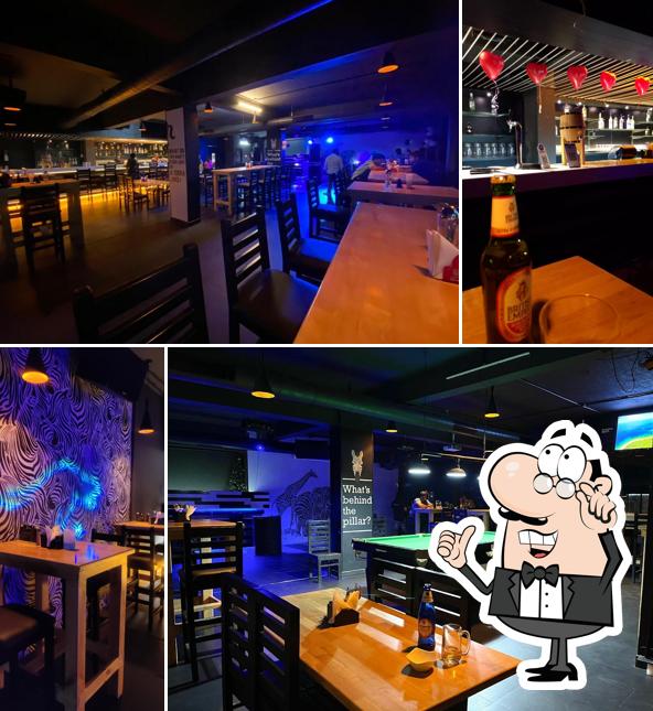Take a seat at one of the tables at Zebra Crossing Lounge