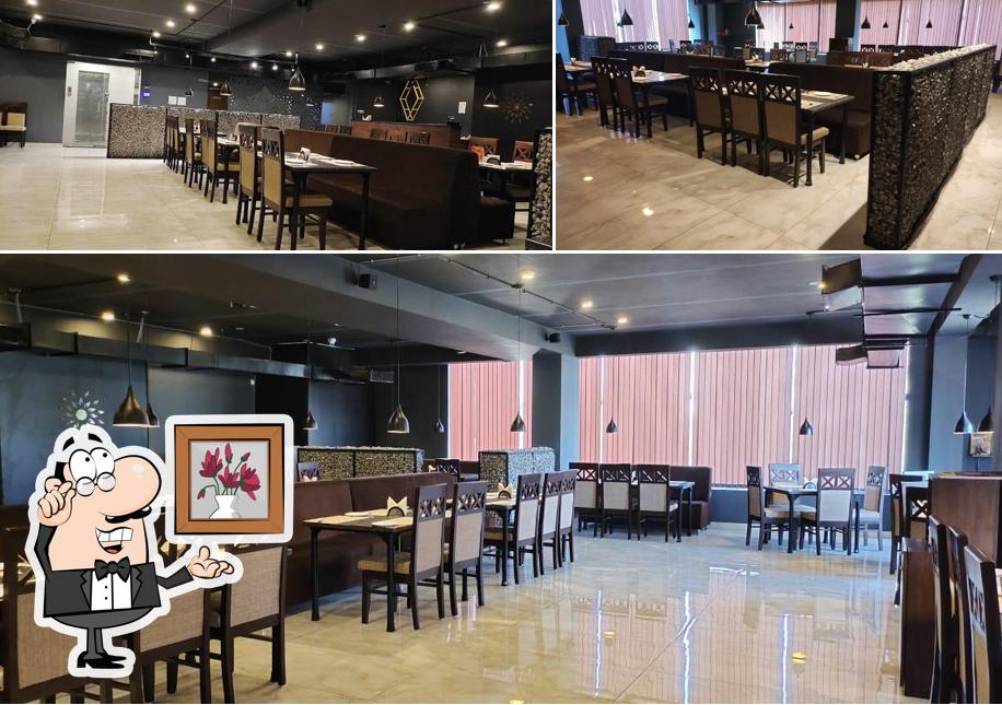 Take a seat at one of the tables at SPICE NATION restaurant