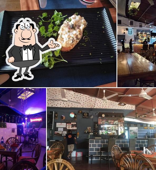 Take a seat at one of the tables at YOU & ME MULTI CUISINE