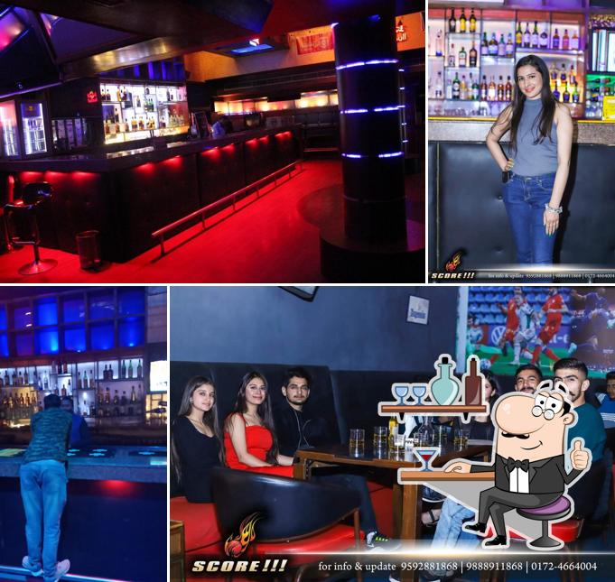 Take a seat at one of the tables at Score Lounge Bar Night Club