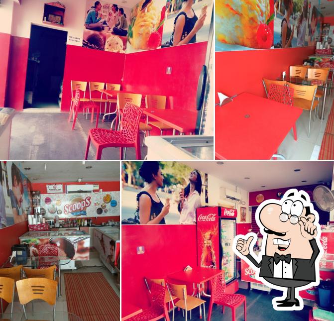 Take a seat at one of the tables at Scoops Ice Cream