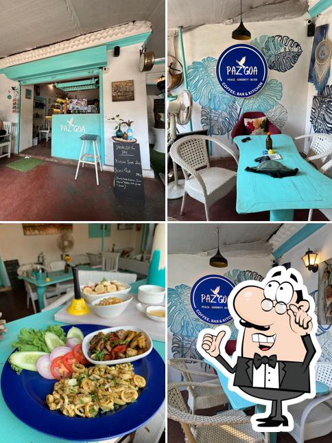Take a seat at one of the tables at PAZ GOA CAFE Vagator