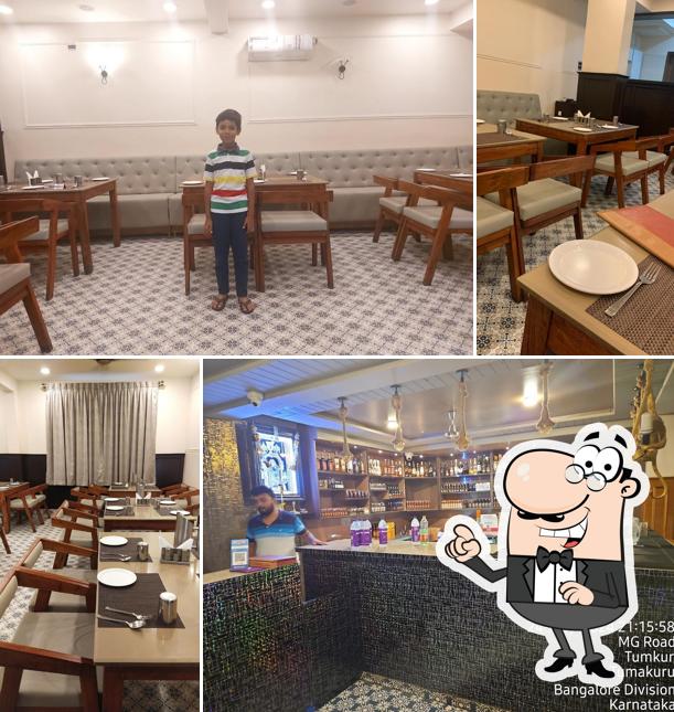 Take a seat at one of the tables at Hotel Landmark