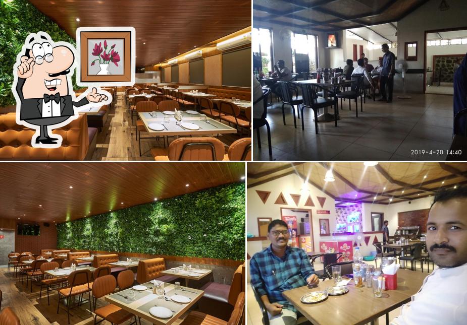 Take a seat at one of the tables at Hotel Prasad Deluxe