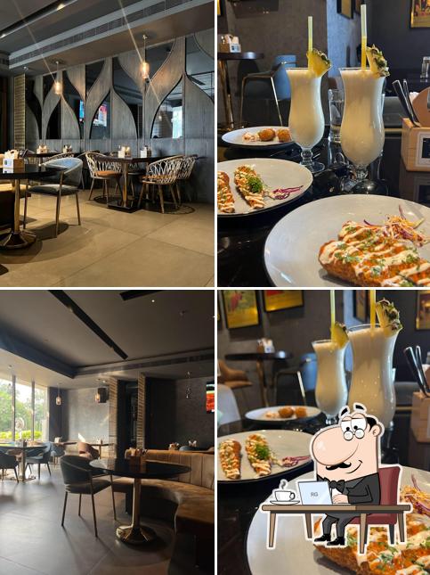 Take a seat at one of the tables at 24K Kraft Brewzz Fine Dine Restaurant Taproom Lounge Bar