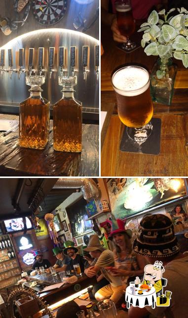 Confira a imagem apresentando comida e balcão de bar no Le Grand Duc PUB