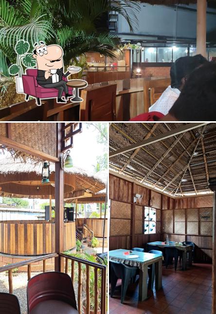 Take a seat at one of the tables at PATHAYAM RESTAURANT