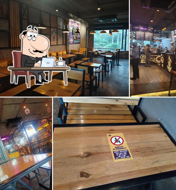 Take a seat at one of the tables at The Burger Club