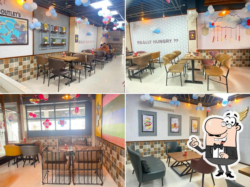Take a seat at one of the tables at Hungry Point - Rayya