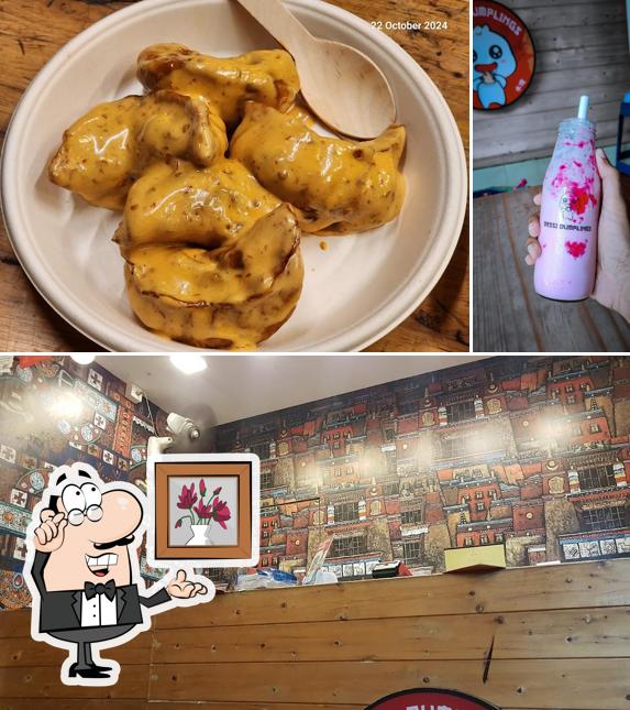 Take a seat at one of the tables at Dessi Dumplings North paravur