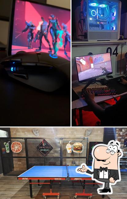 Take a seat at one of the tables at inFAMOUS Gaming Cafe