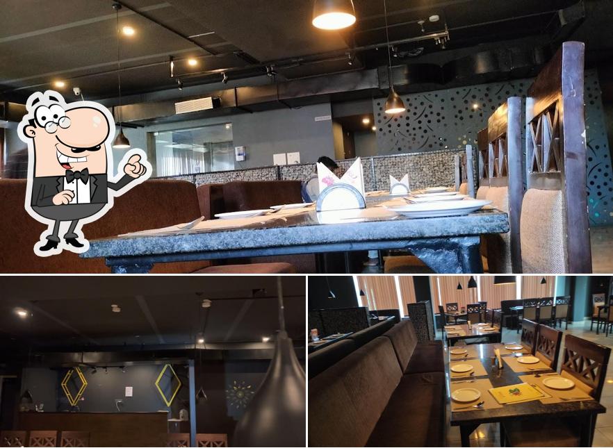 Take a seat at one of the tables at SPICE NATION restaurant