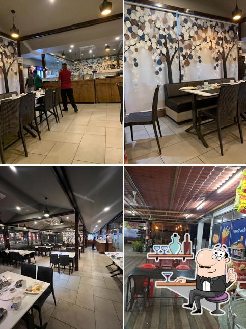 Take a seat at one of the tables at Swad Sagar Restaurant