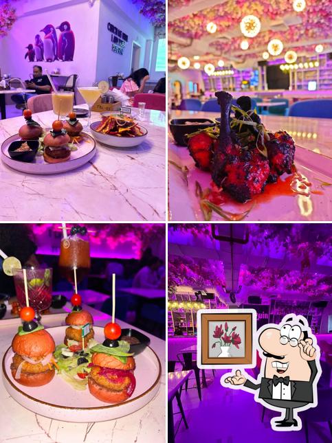 Take a seat at one of the tables at PURPLE PENGUIN