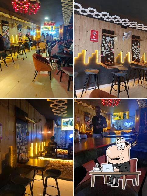 Take a seat at one of the tables at Chai Sutta Bar Ludhiana