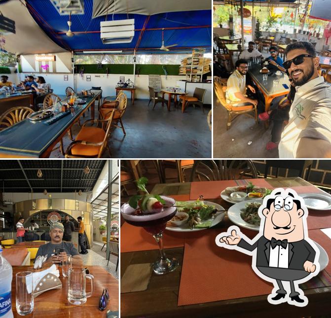 Take a seat at one of the tables at YOU & ME MULTI CUISINE