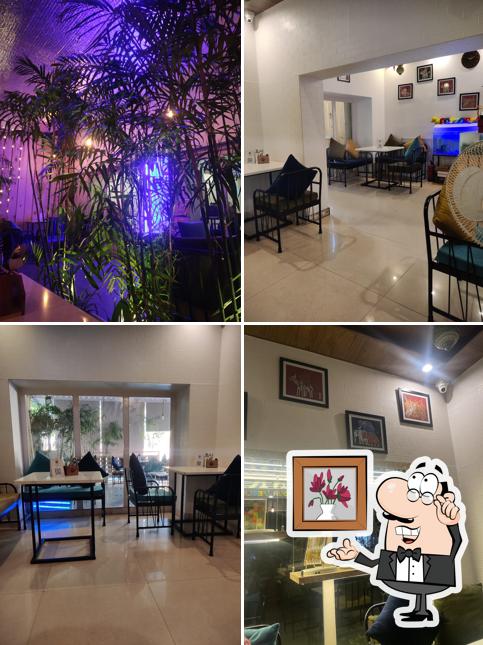 Take a seat at one of the tables at TSC - The ShoShaaa Café - 1, टी.एस.सी. - शोशा कैफे - 1, Old Income Tax Office Road Best Cafe of Udaipur