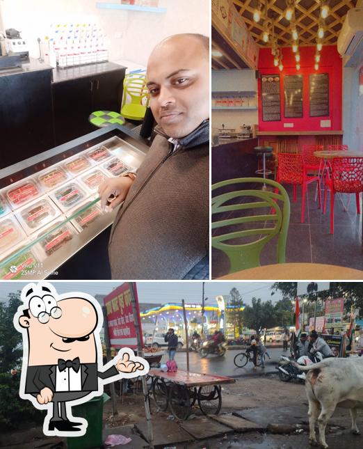 Take a seat at one of the tables at Dr. Bubbles Gomtinagar - Bubble Tea Specialist