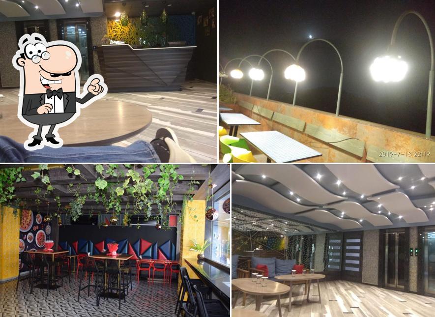 Take a seat at one of the tables at Hummingbird Hotel & Banquet