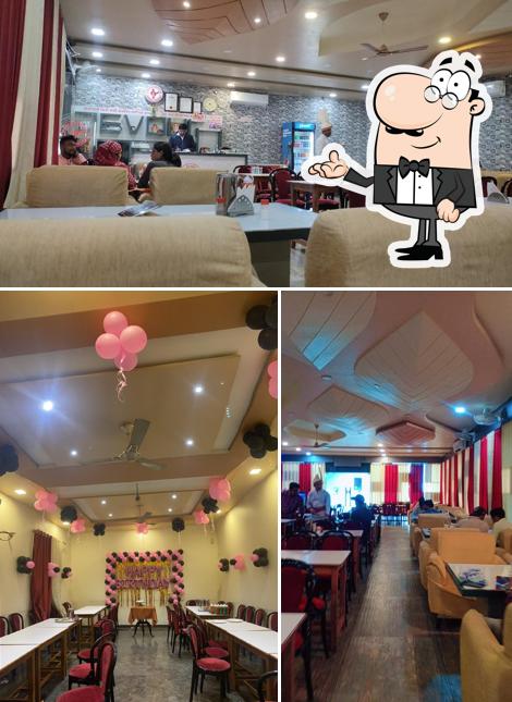 Take a seat at one of the tables at Indian Coffee House Shahdol