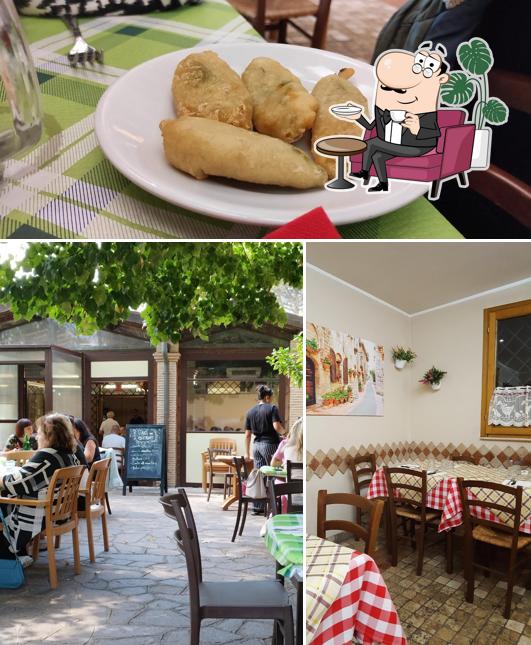 Questa è la immagine che raffigura la interni e cibo di Ristorante Pizzeria Il Casale Roma