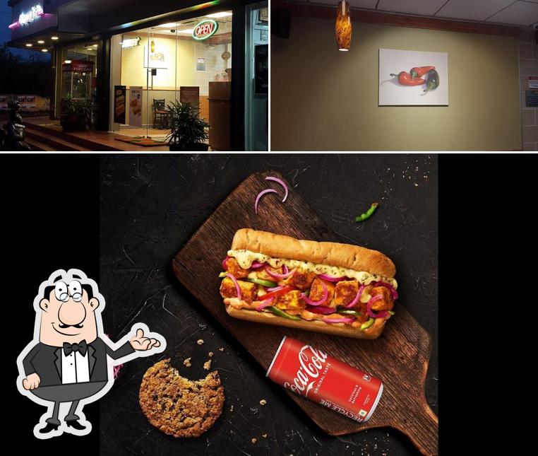 This is the picture depicting interior and food at Subway Saibaba Colony