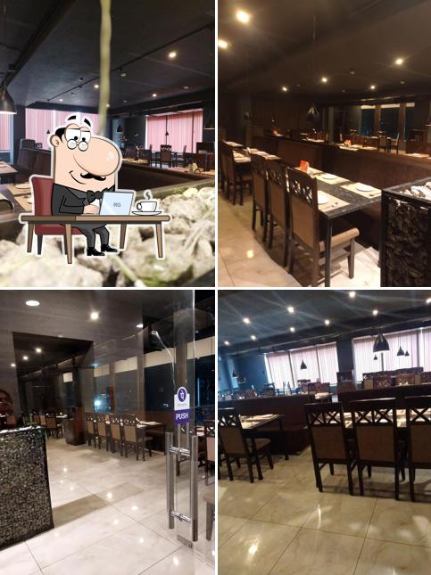 Take a seat at one of the tables at SPICE NATION restaurant