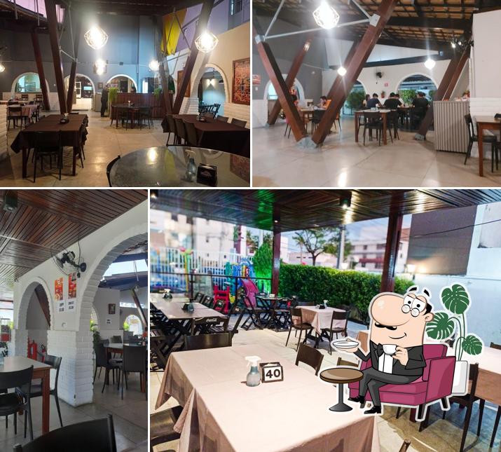 O interior do Mangiare Pizzaria
