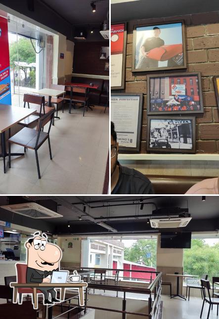 Take a seat at one of the tables at Domino's Pizza Pimple Nilakh, Pune