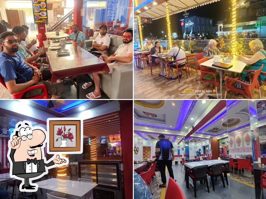 Take a seat at one of the tables at Punjabi kitchen Bar & Restaurant