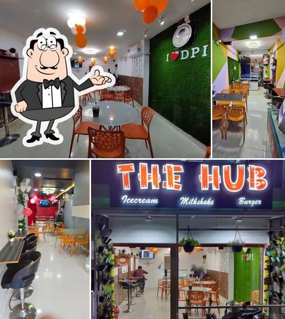 Take a seat at one of the tables at THE HUB CAFE