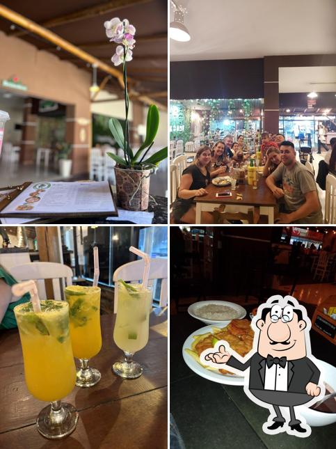 Sente em uma das mesas no Yacare Resto Bar