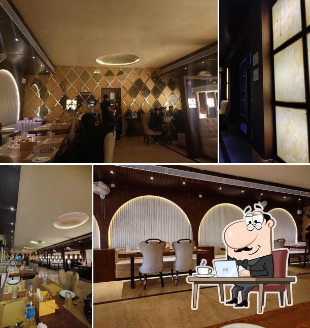 Take a seat at one of the tables at Leela Multicuisine Restaurant & Banquet Hall