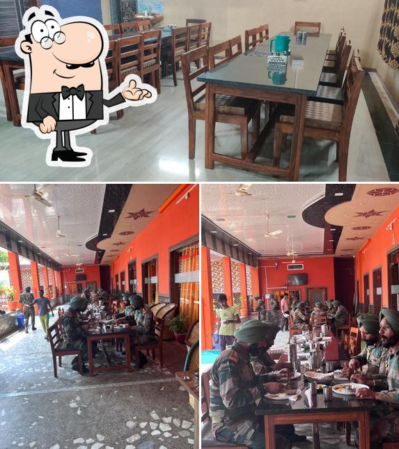 Take a seat at one of the tables at श्री बालाजी होटल एव रेस्टोरेंट