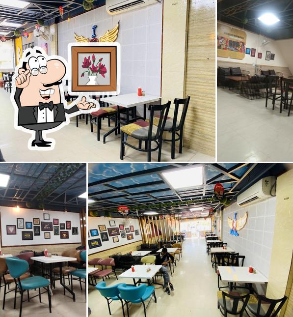 Take a seat at one of the tables at Hungry Point - Nakodar