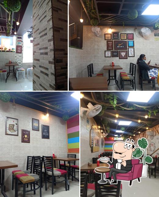 Take a seat at one of the tables at Hungry Point - Kangra