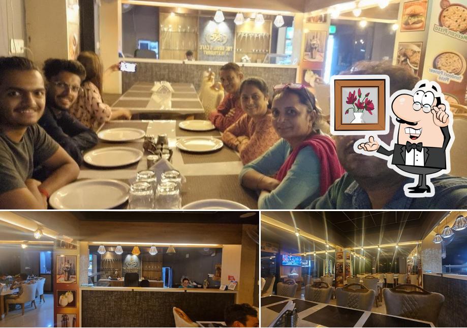 Take a seat at one of the tables at The Royal's Cafe & Restaurant Best Restaurant In Rajpipla Best Family Restaurant Fast Food Restaurant Best Cafe