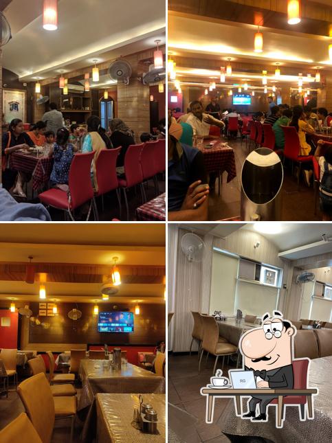 Take a seat at one of the tables at New Upvan Restaurant