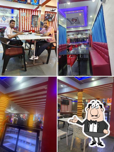Take a seat at one of the tables at Punjabi kitchen Bar & Restaurant
