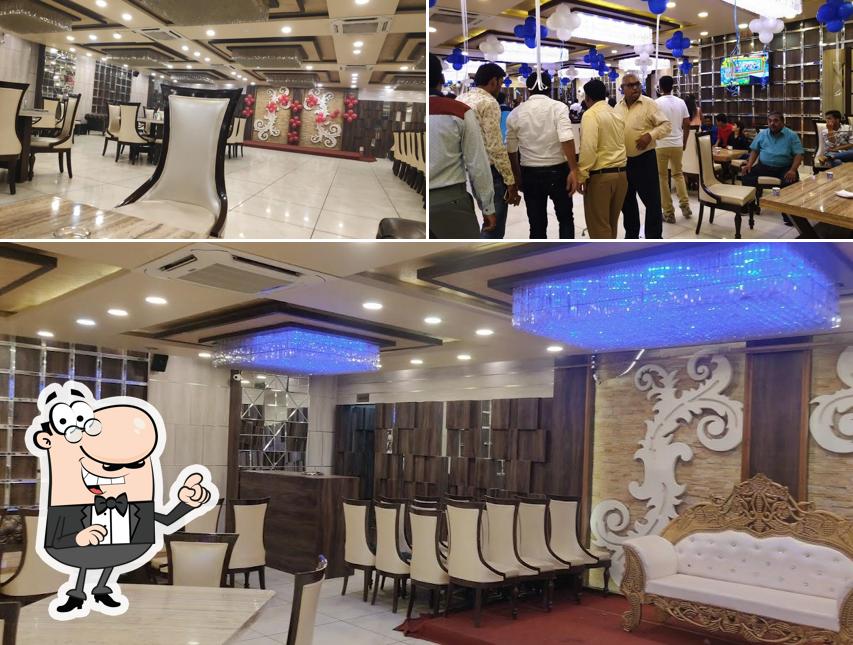 Take a seat at one of the tables at Royal'z Pepper A Fine Dine Restaurant & Banquet