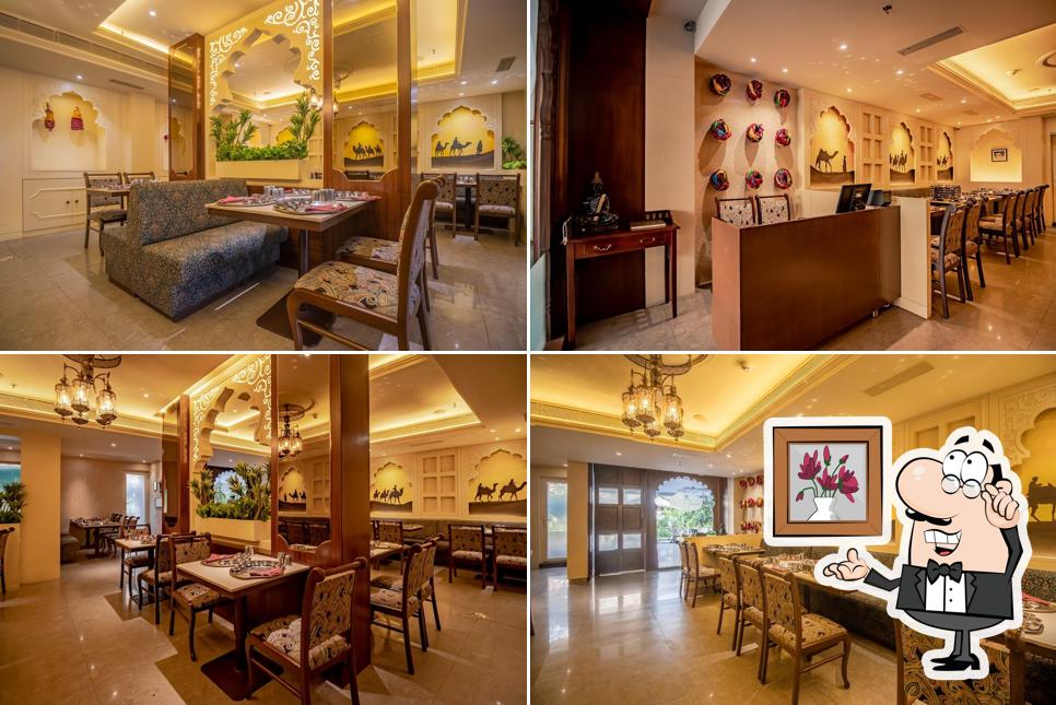 Take a seat at one of the tables at Manbhavan premium thali by Prince's Palace