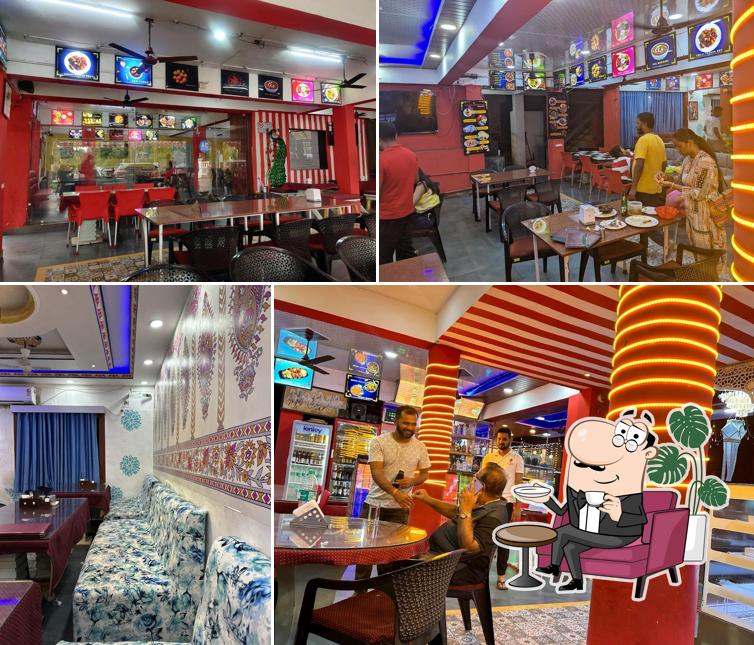 Take a seat at one of the tables at Punjabi kitchen Bar & Restaurant